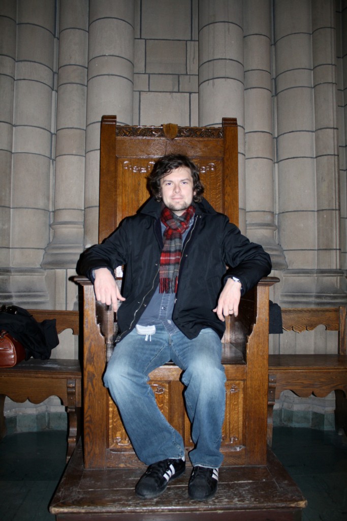 Sitting in the big chair in the study area of the Cathedral of Learning at the University of Pittsburgh.