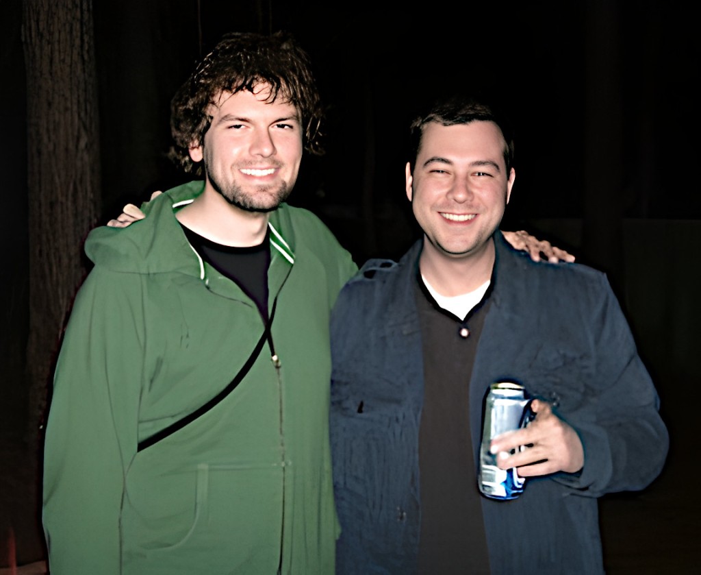 Me in a green hoodie and Chris in a blue jacket outdoors at night.