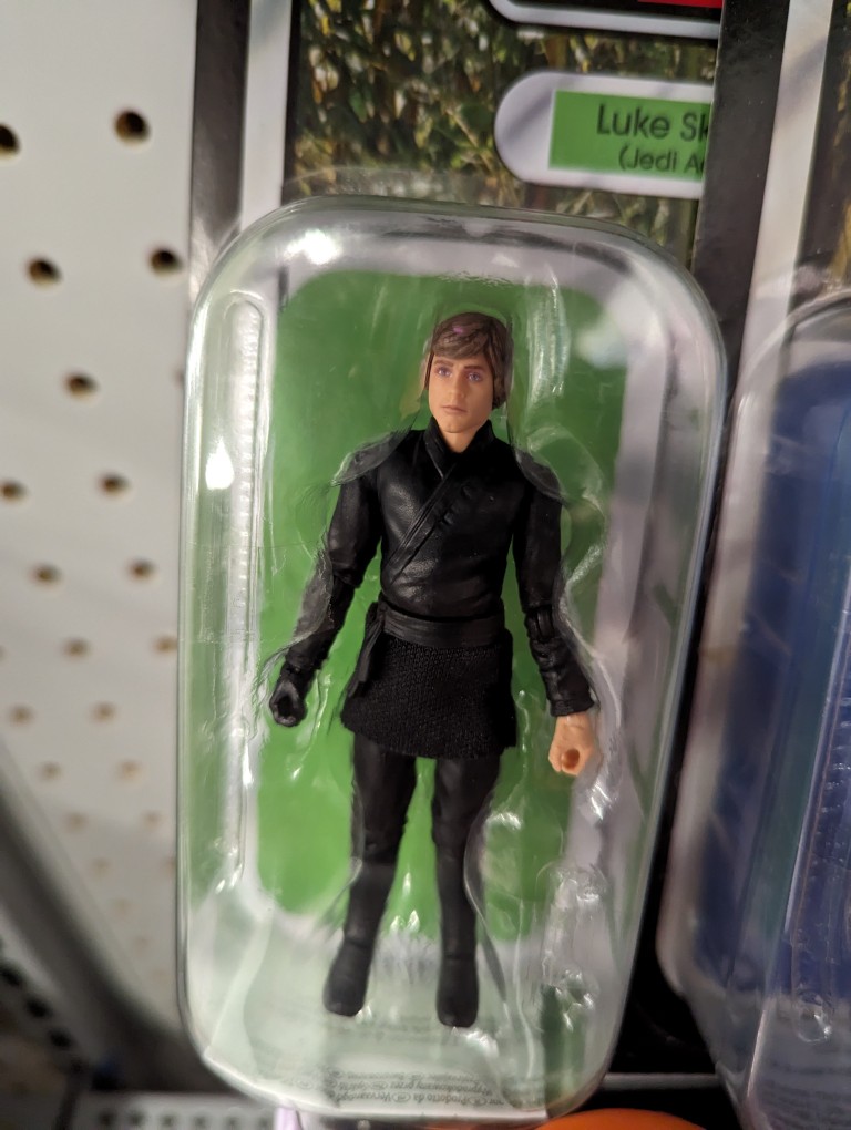 Hasbro Luke Skywalker action figure sealed but missing lightsabers.
