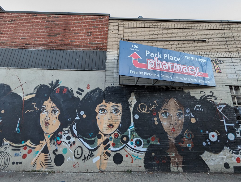 Street art mural of women by Alan Aine at the corner of Park Place and 7th Avenue in Brooklyn.