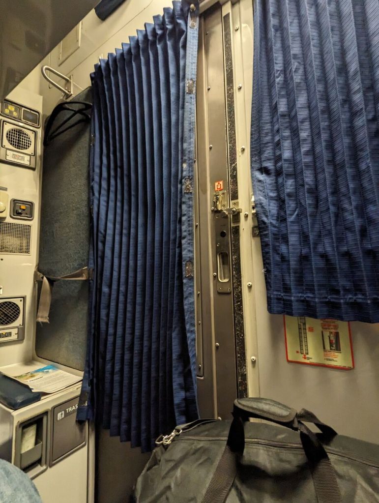 Amtrak Silver Meteor Train, Roomette sliding door and interior window with curtains pulled, Savannah to Penn Station, NYC.