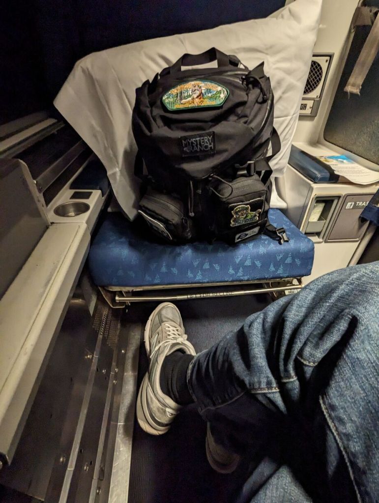 Amtrak Silver Meteor Train, Roomette leg room legs crossed and relaxed, Savannah to Penn Station, NYC.