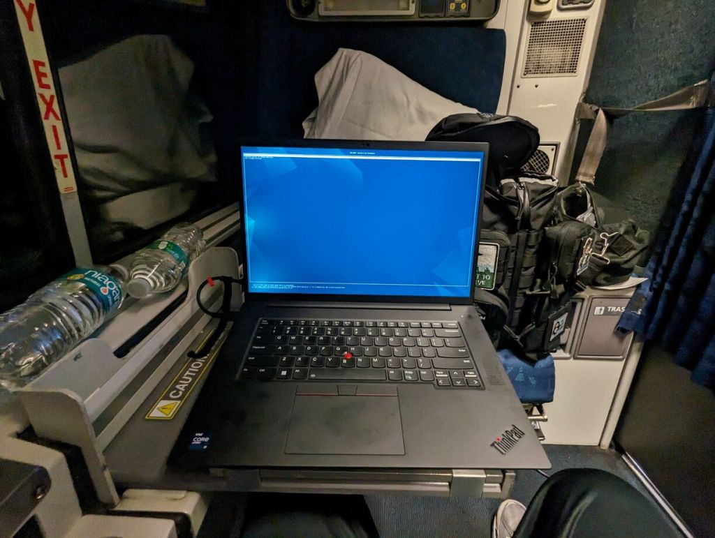 Amtrak Silver Meteor Train, Roomette folding table supporting a 16" Lenovo ThinkPad P1, Savannah to Penn Station, NYC.