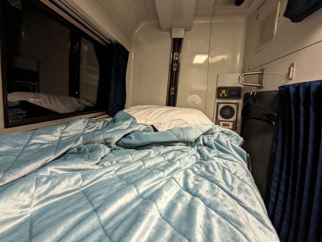 Amtrak Silver Meteor Train, Roomette bunk bed pulled down and made up for sleep, Savannah to Penn Station, NYC.