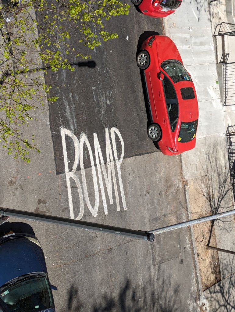 Repainted road warning spelled incorrectly as "Bomp" as see from above.